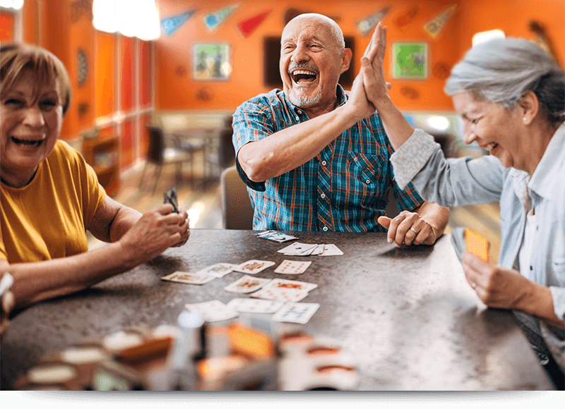 Lauging-man-with-cards-high-five-RecCenter_Accent_H_800x580 Lauging-man-with-cards-high-five-RecCenter_Accent_H_800x580