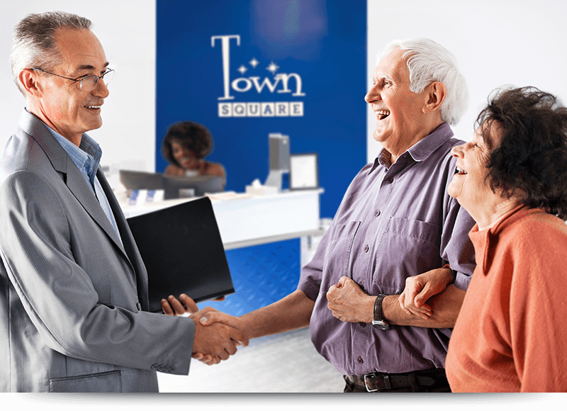 Worker-welcoming-elderly-couple_Accent_H_800x580 Worker-welcoming-elderly-couple_Accent_H_800x580