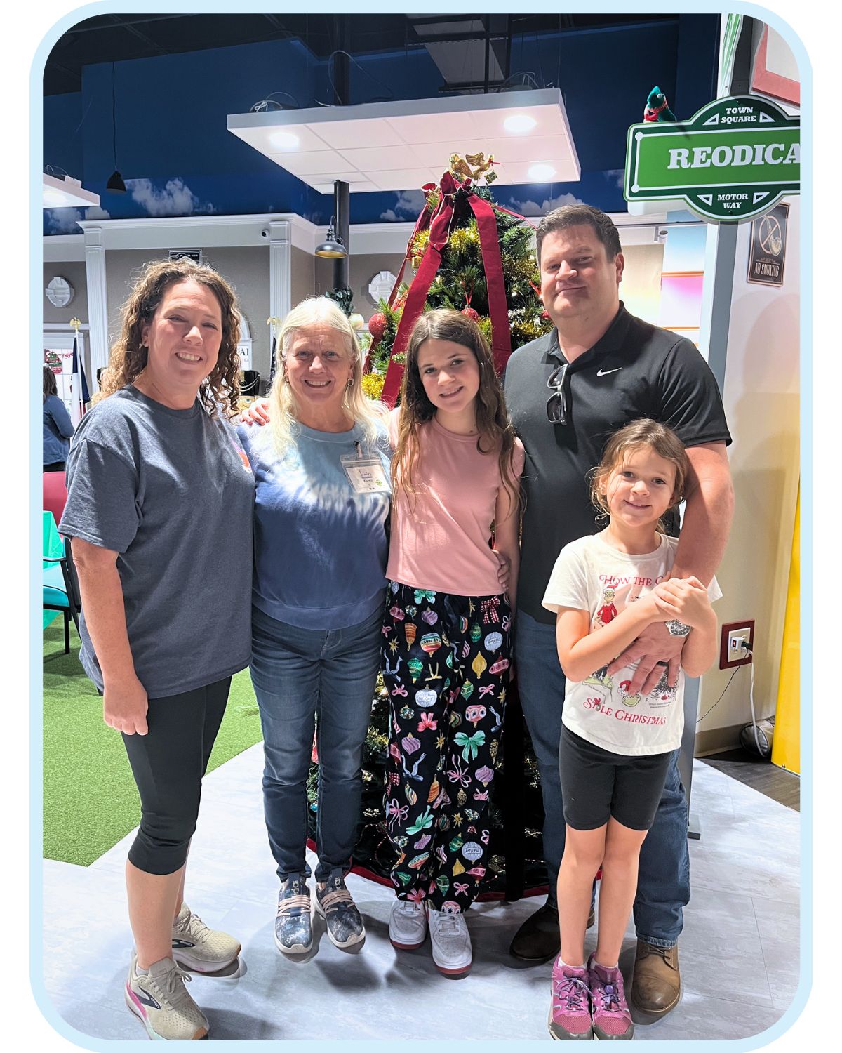 Family visiting together inside Town Square NW Austin, showing caregiver involvement and multigenerational support for a loved one receiving daytime dementia care.